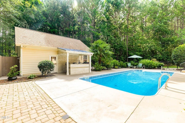 3712 Highland Creek Dr, Apex, NC 27539 - view of swimming pool with a patio area and an outbuilding