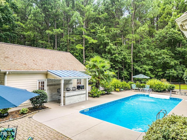 3712 Highland Creek Dr, Apex, NC 27539 - view of swimming pool featuring a patio area and an outdoor kitchen