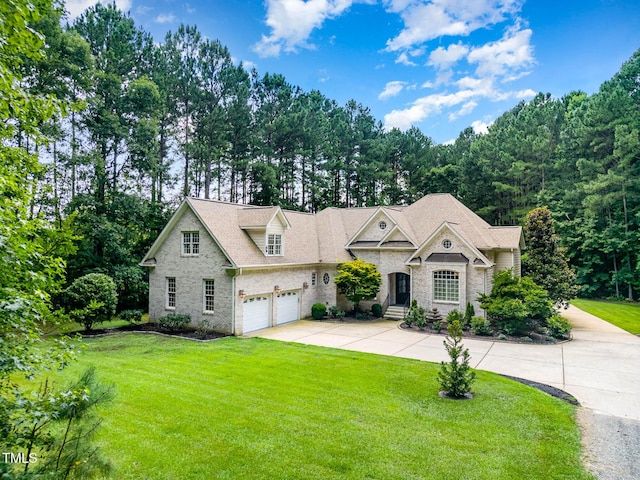 3712 Highland Creek Dr, Apex, NC 27539 - view of front of house featuring driveway, a front lawn, and stone siding