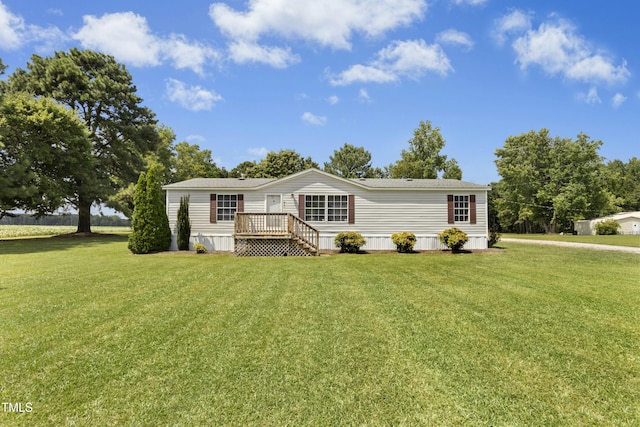 889 Pollock Rd, Kenly, NC 27542 - manufactured / mobile home featuring a front lawn