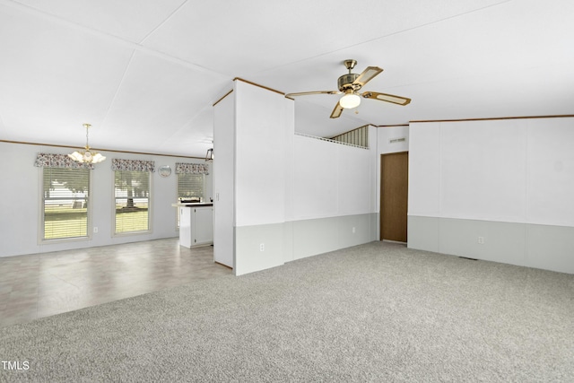889 Pollock Rd, Kenly, NC 27542 - unfurnished room featuring a chandelier, a ceiling fan, and carpet flooring