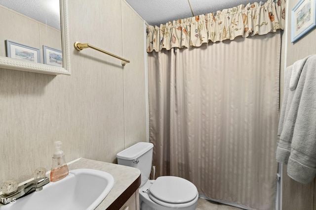 889 Pollock Rd, Kenly, NC 27542 - bathroom with vanity, a textured ceiling, and a shower with curtain