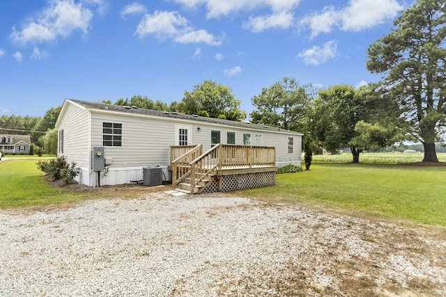 889 Pollock Rd, Kenly, NC 27542 - view of front of house featuring a deck and a front yard