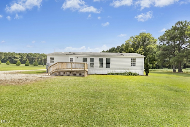 889 Pollock Rd, Kenly, NC 27542 - rear view of property featuring a wooden deck and a yard