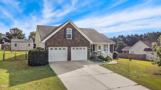 193 Checkmate Ct, Cameron, NC 28326 - traditional home featuring an attached garage, driveway, brick siding, and roof with shingles
