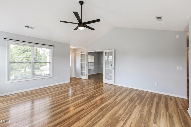 193 Checkmate Ct, Cameron, NC 28326 - spare room featuring a ceiling fan, french doors, light wood-type flooring, and high vaulted ceiling