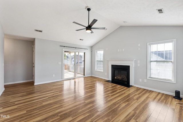 193 Checkmate Ct, Cameron, NC 28326 - unfurnished living room featuring ceiling fan, wood finished floors, lofted ceiling, and a fireplace with flush hearth
