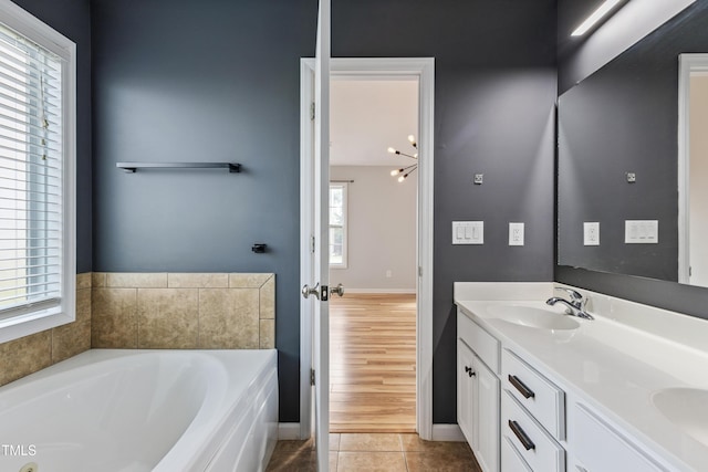 193 Checkmate Ct, Cameron, NC 28326 - bathroom with double vanity, a garden tub, and tile patterned floors