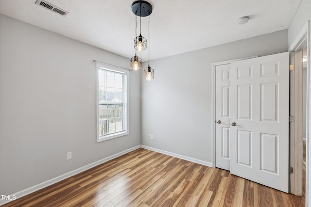 193 Checkmate Ct, Cameron, NC 28326 - unfurnished dining area with wood finished floors and baseboards
