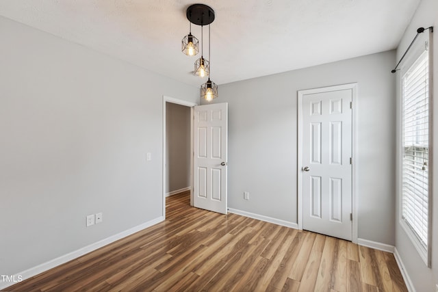 193 Checkmate Ct, Cameron, NC 28326 - unfurnished bedroom featuring wood finished floors and baseboards