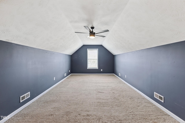 193 Checkmate Ct, Cameron, NC 28326 - bonus room with lofted ceiling, carpet flooring, a ceiling fan, and a textured ceiling