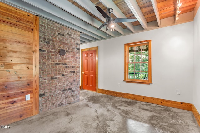2419 Hodges Rd, Burlington, NC 27217 - empty room with a ceiling fan, a wood ceiling with exposed beams, and unfinished concrete floors