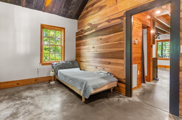 2419 Hodges Rd, Burlington, NC 27217 - bedroom with wooden walls, concrete floors, multiple windows, wooden ceiling, and vaulted ceiling