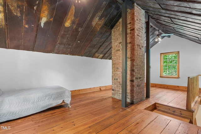 2419 Hodges Rd, Burlington, NC 27217 - bedroom with wood-type flooring and lofted ceiling