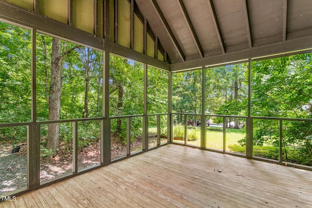 2419 Hodges Rd, Burlington, NC 27217 - unfurnished sunroom featuring lofted ceiling and view of scattered trees