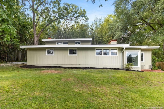 1814 Sunnyside Cir, Fayetteville, NC 28305 - back of house featuring a lawn and a chimney