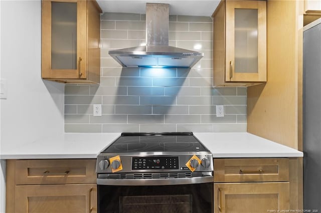 1814 Sunnyside Cir, Fayetteville, NC 28305 - kitchen with stainless steel appliances, exhaust hood, light countertops, and decorative backsplash