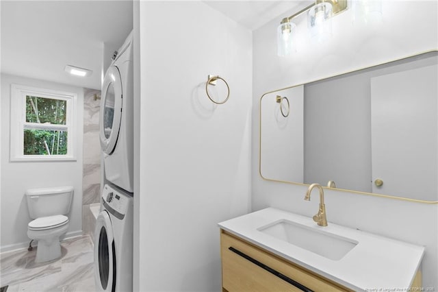 1814 Sunnyside Cir, Fayetteville, NC 28305 - bathroom featuring vanity, stacked washer and clothes dryer, and marble finish flooring