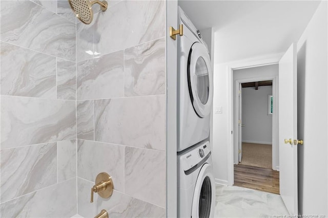 1814 Sunnyside Cir, Fayetteville, NC 28305 - washroom featuring stacked washing machine and dryer and light marble finish floors