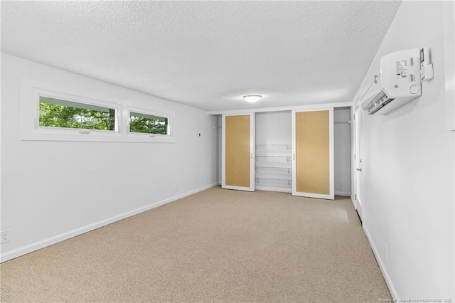 1814 Sunnyside Cir, Fayetteville, NC 28305 - unfurnished bedroom featuring a textured ceiling, carpet, and a wall mounted AC