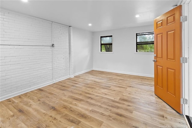 1814 Sunnyside Cir, Fayetteville, NC 28305 - unfurnished room featuring brick wall, light wood finished floors, and recessed lighting