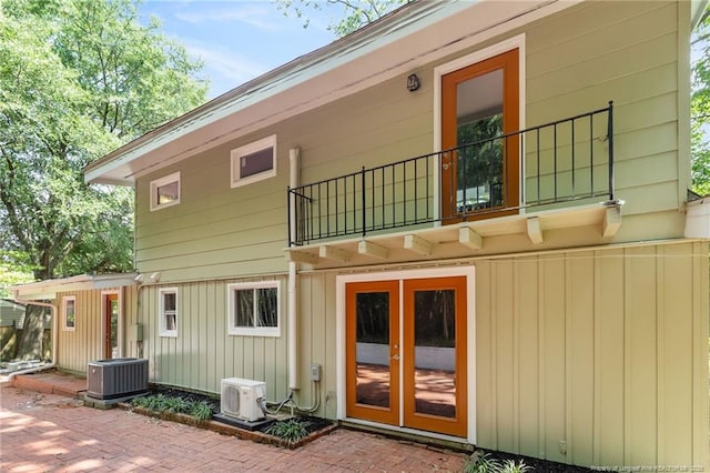 1814 Sunnyside Cir, Fayetteville, NC 28305 - rear view of property featuring a balcony, a patio area, and french doors