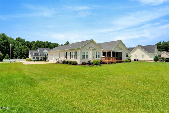 1421 Hopson Downs Ct, Holly Springs, NC 27540 - rear view of house featuring a sunroom, a yard, an attached garage, and concrete driveway