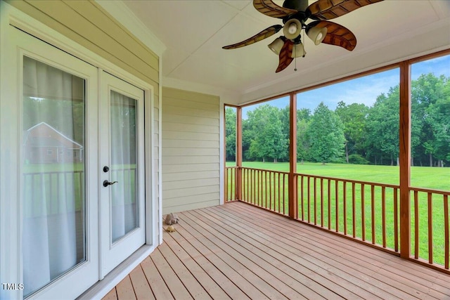 1421 Hopson Downs Ct, Holly Springs, NC 27540 - unfurnished sunroom with a deck, a ceiling fan, crown molding, hardwood / wood-style floors, and view of wooded area