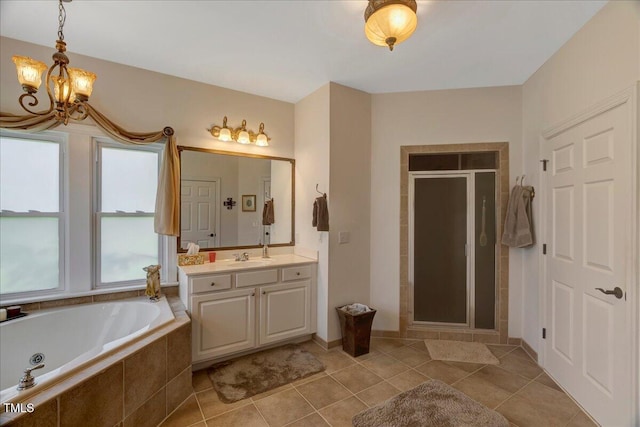1421 Hopson Downs Ct, Holly Springs, NC 27540 - full bathroom featuring vanity, a chandelier, a whirlpool tub, a shower stall, and tile patterned flooring