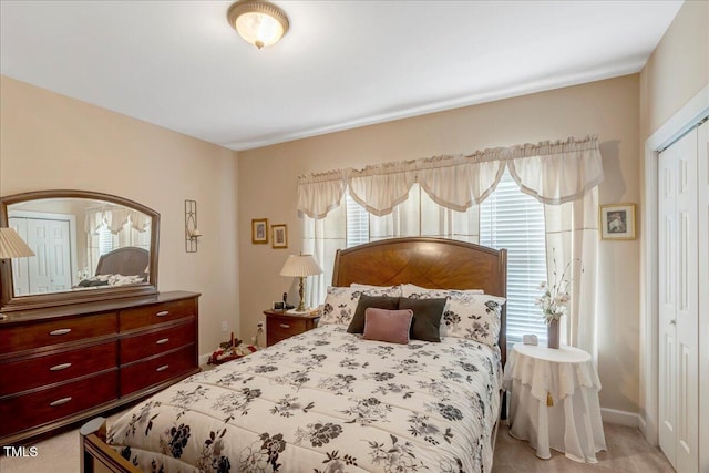 1421 Hopson Downs Ct, Holly Springs, NC 27540 - bedroom featuring a closet and light colored carpet