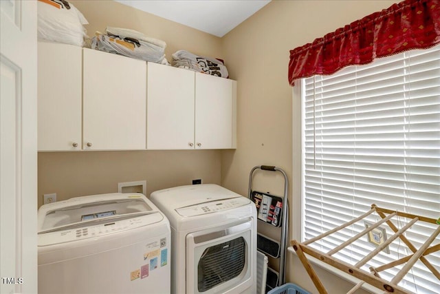 1421 Hopson Downs Ct, Holly Springs, NC 27540 - laundry room featuring washer and clothes dryer and cabinet space