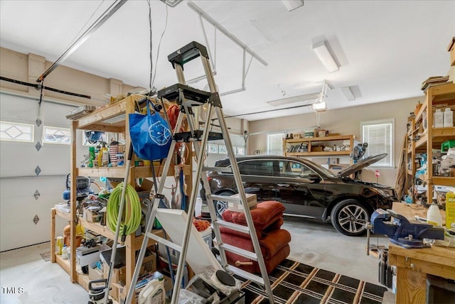1421 Hopson Downs Ct, Holly Springs, NC 27540 - garage with a garage door opener and a workshop area