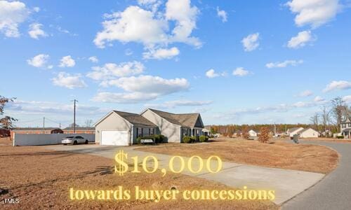 108 Caroline Ln, Goldsboro, NC 27534 - view of front facade with driveway and an attached garage