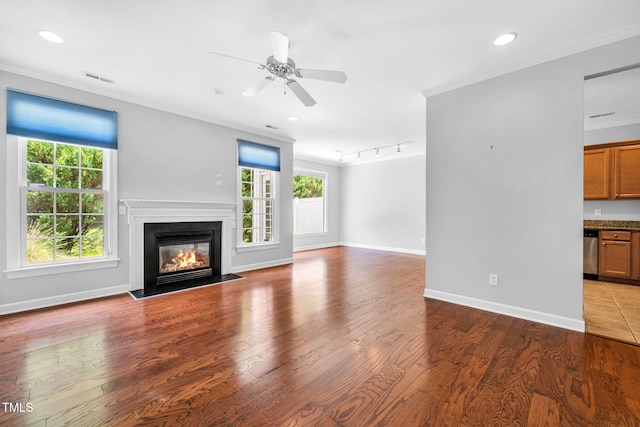 5515 S Roxboro St Unit 3, Durham, NC 27713 - unfurnished living room with plenty of natural light, ceiling fan, a glass covered fireplace, wood finished floors, and recessed lighting
