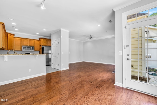 5515 S Roxboro St Unit 3, Durham, NC 27713 - unfurnished living room with crown molding, recessed lighting, ceiling fan, and wood finished floors