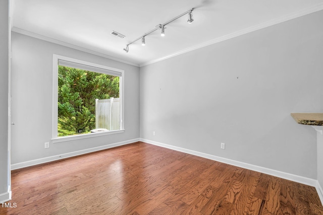 5515 S Roxboro St Unit 3, Durham, NC 27713 - empty room featuring ornamental molding, track lighting, and wood finished floors