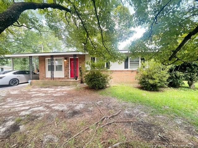 639 Berwick Dr, Fayetteville, NC 28314 - view of front of property with brick siding and a carport