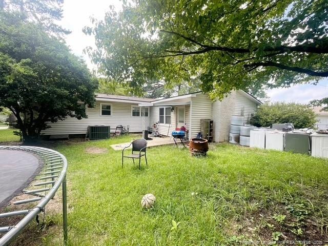 639 Berwick Dr, Fayetteville, NC 28314 - back of property featuring a yard and a patio area