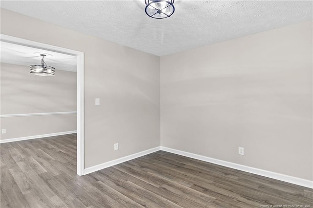 806 Eagle Landing Dr, Hope Mills, NC 28348 - unfurnished room with wood finished floors and a textured ceiling