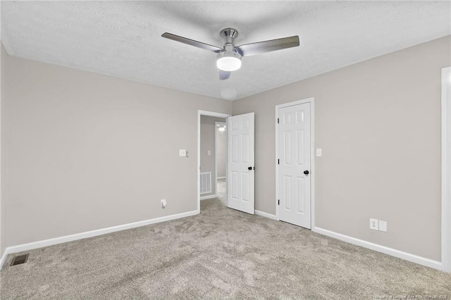 806 Eagle Landing Dr, Hope Mills, NC 28348 - unfurnished bedroom with carpet floors, a textured ceiling, and a ceiling fan