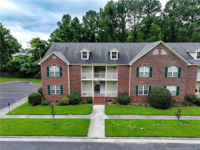 3401 Lainey Ln Unit D, Fayetteville, NC 28314 - view of front of house featuring brick siding, a front lawn, crawl space, uncovered parking, and a balcony