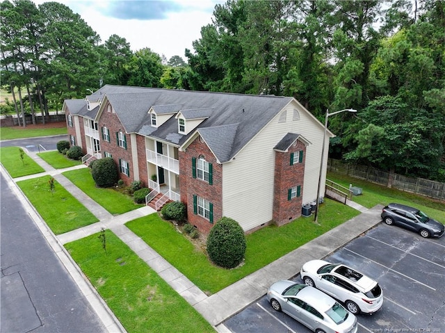 3401 Lainey Ln Unit D, Fayetteville, NC 28314 - view of front of property with brick siding, uncovered parking, and roof with shingles