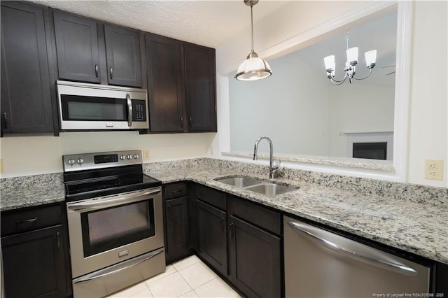 3401 Lainey Ln Unit D, Fayetteville, NC 28314 - kitchen with appliances with stainless steel finishes, light tile patterned floors, and light stone countertops