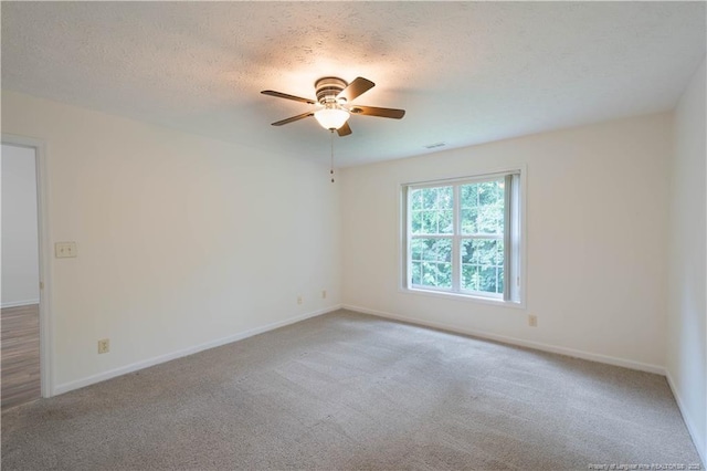 3401 Lainey Ln Unit D, Fayetteville, NC 28314 - empty room with carpet floors, ceiling fan, and a textured ceiling