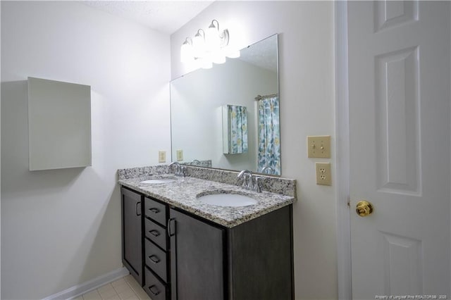 3401 Lainey Ln Unit D, Fayetteville, NC 28314 - bathroom with double vanity and baseboards