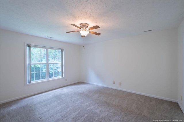 3401 Lainey Ln Unit D, Fayetteville, NC 28314 - spare room featuring carpet, ceiling fan, and a textured ceiling
