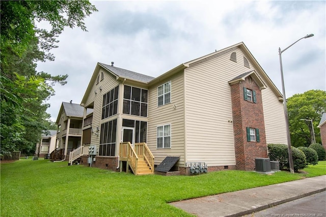 3401 Lainey Ln Unit D, Fayetteville, NC 28314 - back of house featuring crawl space, a sunroom, and a lawn