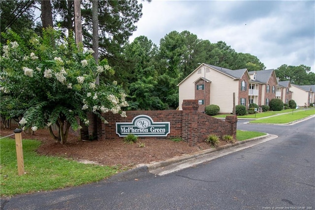 3401 Lainey Ln Unit D, Fayetteville, NC 28314 - community sign featuring a lawn and a residential view