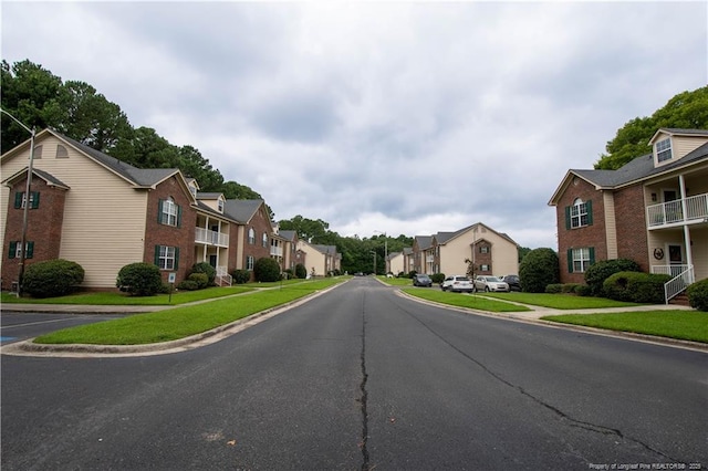 3401 Lainey Ln Unit D, Fayetteville, NC 28314 - view of asphalt street with a residential view, sidewalks, and curbs