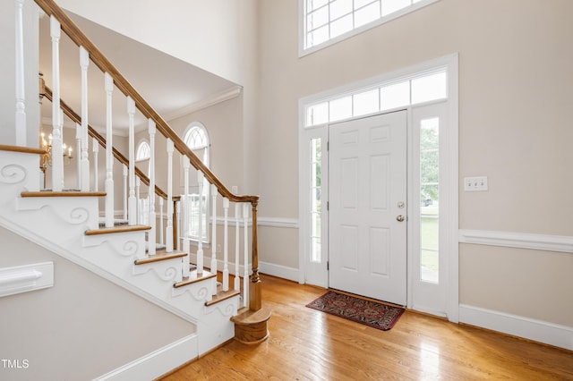 2464 Village Of Wakefield Dr, Zebulon, NC 27597 - entrance foyer featuring wood finished floors, stairway, and a high ceiling